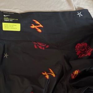 Nike Kids Black Leggings with Red and Orange Accents